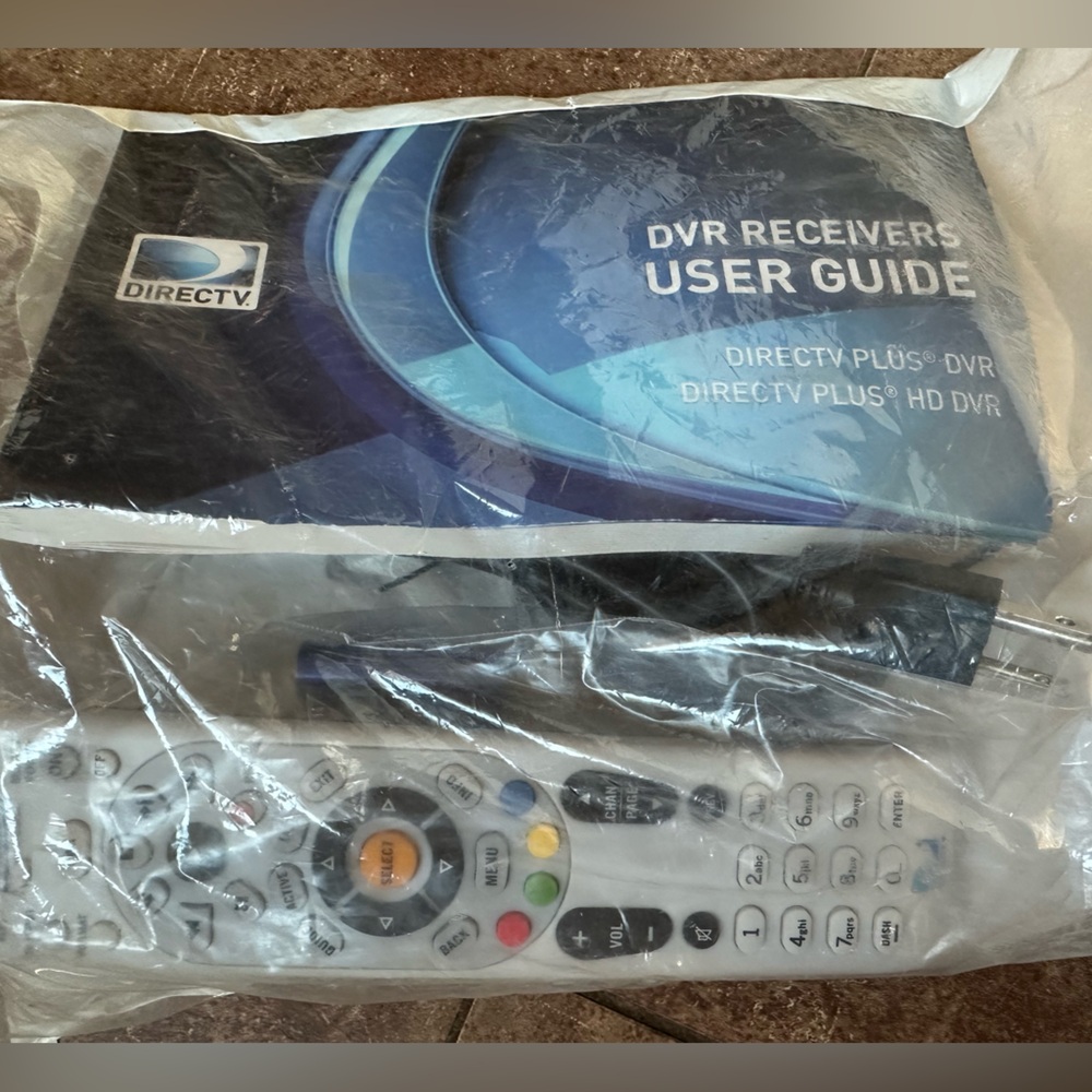 New remote for Direct TV with batteries & cable & book